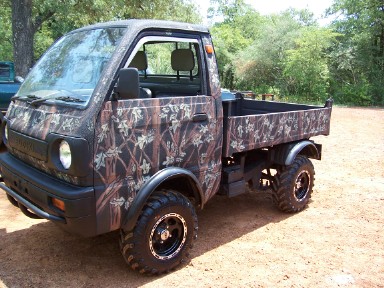 hunting mini truck with camo bedliner paint job