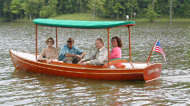 electric wooden boat with canopy
